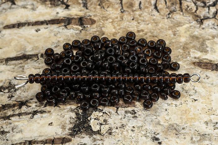 Seed Beads transparent 2,6 mm, Mrkbrun (20g)