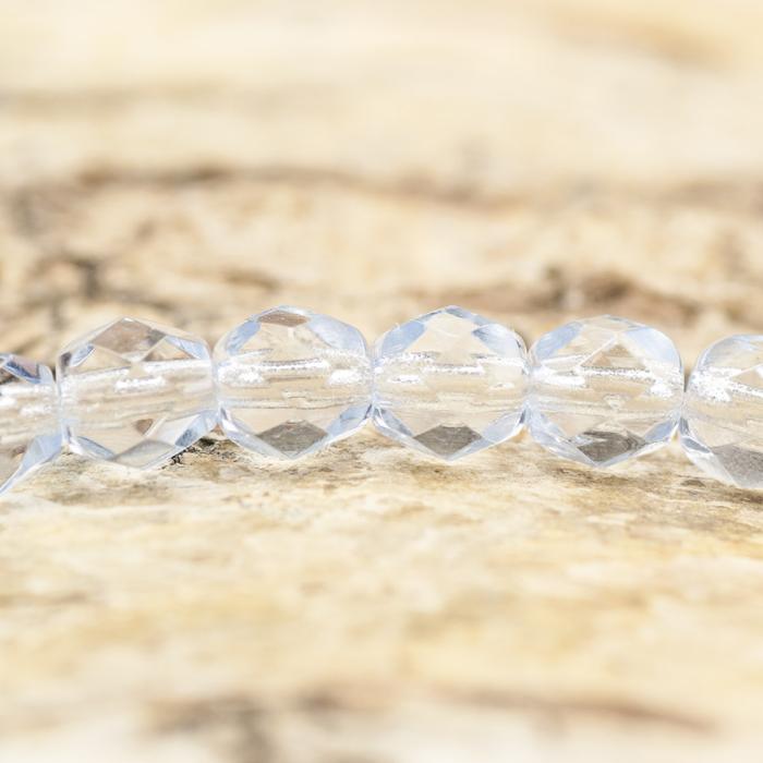 Glaspärla facetterad 4,5x5 mm, Isblå (25st)