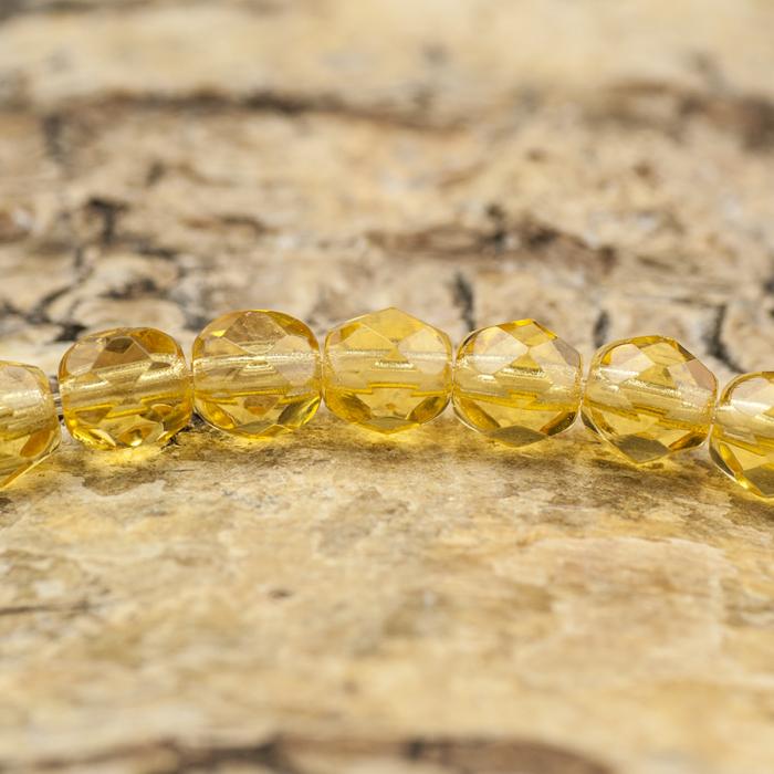 Glaspärla facetterad 4,5x5 mm, Honungsgul (25st)