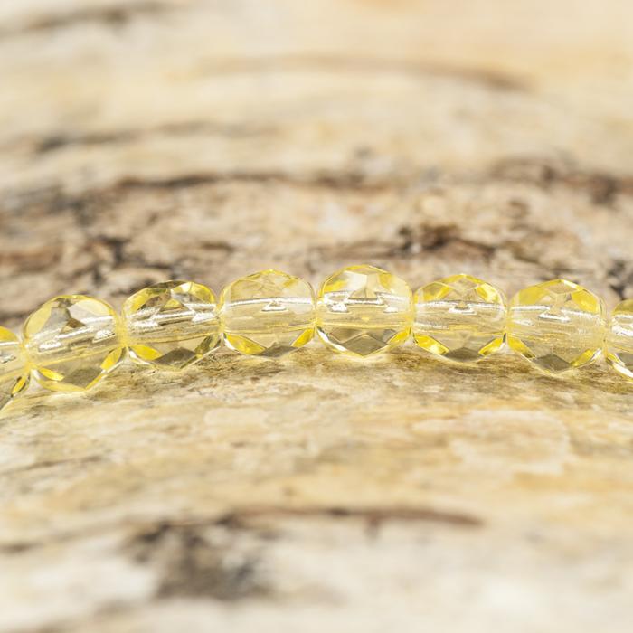 Glaspärla facetterad 4,5x5 mm, Ljusgul (25st)