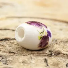 Porslinspärla oval 10,5x8 mm, Vit med lilarosa blommor (st)