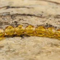 Glaspärla facetterad 4,5x5 mm, Bärnsten (25st)